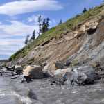 The tide and wind waves eat at the bottom of Kenai Bluff during high tide below Toyon Way in Kenai in this June 2013 photo. (Clarion file photo)