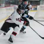 Photo by Kelly Sullivan/ Peninsula Clarion Kenai Central High School's Dalton Dosko takes the control of the puck in the game against Chugiak High School Friday, Jan. 9, 2015, at the Soldotna Regional Sports Complex in Soldotna, Alaska.