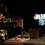 Photo by Rashah McChesney/Peninsula Clarion  Lee Kuepper, guide with Alaska's Angling Addiction demonstrates a fly tying technique during a class offered by Trout Unlimited on Tuesday Jan. 6, 2014 at the Main Street Tap & Grill in Kenai, Alaska.