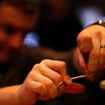 Photo by Rashah McChesney/Peninsula Clarion  About 20 people gathered in a corner of the Main Street Tap & Grill on Tuesday Jan. 6, 2014 for a free fly tying class sponsored by the Kenai Peninsula chapter of Trout Unlimited in Kenai, Alaska.