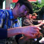 Photo by Rashah McChesney/Peninsula Clarion  Toby Long works on a fly during a free class sponsored by the Kenai Peninsula Chapter of Trout Unlimited on Tuesday Jan. 6, 2014 at the MAin Street Tap & Grill in Kenai, Alaska.