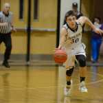 Photo by Rashah McChesney/Peninsula Clarion Nikiski's Sam Tauriained sprints down the court during their game against Homer on Saturday Jan. 10,  2015 at Nikiski Middle-High School in Nikiski, Alaska.