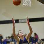 Photo by Rashah McChesney/Peninsula Clarion Homer's Brandon Beachy grabs a rebound during their game against Nikiski on Saturday Jan. 10,  2015 at Nikiski Middle-High School in Nikiski, Alaska.