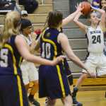 Photo by Rashah McChesney/Peninsula Clarion Nikiski's Rachel Thompson passes during their gam Homere on Saturday Jan. 10,  2015 at Nikiski Middle-High School in Nikiski, Alaska.