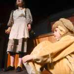 Photo by Rashah McChesney/Peninsula Clarion  Annie (Anya Hondel) and a stray dog Sandy (Kincaid Jenness) rehearse for the Triumvirate Theatre's production of the musical Annie on Tuesday Jan. 13, 2014 in Nikiski, Alaska.