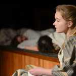 Photo by Rashah McChesney/Peninsula Clarion Annie (Anya Hondel) sings a group of orphans to sleep during rehearsal for the Triumvirate Theatre's production of Annie on Tuesday Jan. 13, 2014 in Nikiski, Alaska.