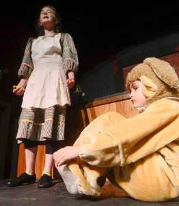 Photo by Rashah McChesney/Peninsula Clarion  Annie (Anya Hondel) and a stray dog Sandy (Kincaid Jenness) rehearse for the Triumvirate Theatre's production of the musical Annie on Tuesday Jan. 13, 2014 in Nikiski, Alaska.
