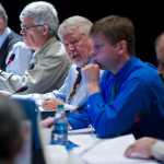 Chairman Karl Johnstone, center, runs a Alaska Board of Fisheries meeting at Centennial Hall on Wednesday. Along with Johnstone are board members Fritz Johnson, left, Tom Kluberton, second from left, Glenn Haight, Executive Director, second from right, and John Jensen. The meetings continue on Thursday.