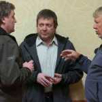 Photo by Rashah McChesney/Peninsula Clarion In this March 21, 2013 file photo, Ricky Gease, executive director of the Kenai River Sportfishing Association, former Board of Fisheries member Vince Webster and Karl Johnstone, Board of Fisheries chairman, talk during a break at a Board of Fish meeting in Anchorage, Alaska. Johnstone announced his resignation on Tuesday.  Governor Bill Walker appointed Cook Inlet fisherman Roland Maw to replace him.