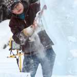 An Qui Feng of Harbin, China cuts away at an ice block while working on a sculpture that will depict Gov. Bill Walker and Lt. Gov. Byron Mallott as work begins on this year's Ice Alaska Ice Park in Fairbanks, Alaska Monday afternoon, Jan. 19, 2015 in preparation for the 2015 BP World Ice Art Championships. The park opens Feb. 23. (AP Photo/Fairbanks Daily News-Miner, Eric Engman)