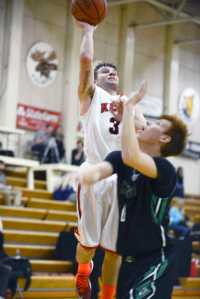 Photo by Rashah McChesney/Peninsula Clarion  Kenai Central High School Trevor Shirnberg lands a layup during their game against Palmer on Saturday Jan. 23, 2014 in Kenai, Alaska.