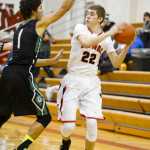 Photo by Rashah McChesney/Peninsula Clarion  Kenai's Keith Ivy looks for an opening to pass during their game against the Colony on Friday Jan. 22, 2014 in Kenai, Alaska.