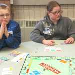 Ben Boettger/Peninsula Clarion Drew Cox (left) plays Monopoly against Briley Morton i(right) in the Winter Games Monopoly tournament at the Soldotna Sports Center on Saturday, Jan. 24.