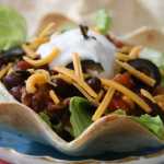 With pre-baked tortilla shells, some ground beef and a few items from the pantry, a colorful and fun chili dish can be pulled together in just 15 minutes.