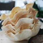 Mini tortilla bakers were used to make these tortilla "bowls,"  but  small brioche molds work well, too.