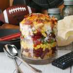 Southwestern Cornbread Layered Salad brims over with fresh flavor and vibrant color. For fun, the salad may be eaten from baked tortilla "bowls."