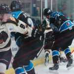 Photo by Kelly Sullivan/ Peninsula Clarion Kenai Brown Bears' Evan Butcher makes a quick to turn chase after the puck behind the Wenatchee Wild goal Thursday, Jan. 29, 2015, at the Soldotna Regional Sports Complex in Soldotna, Alaska.