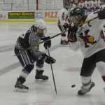 Ben Boettger/Peninsula Clarion Soldotna's Levi Hensley faces Kenai's Dalton Dosko in a hockey match on Saturday Jan. 31 at the Soldotna Sports Center.
