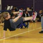 Youths compete Alaskan high kick event at NYO's.