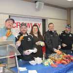 Crowley employees serve up over 1,200 free corn dogs.