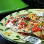 Colorful Brazilian Fish Tagine is flavored with coconut milk, an assortment of sweet bell peppers, onions, tomatoes and fresh cilantro.