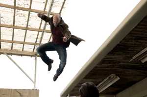 This photo released by Lionsgate shows, Jason Statham, center, as Nick Wild in a scene from the film, "Wild Card." (AP Photo/Lionsgate)