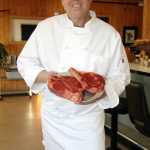 Chef Steve Drolet shows why his new steakhouse is called "The Porterhouse Grill.