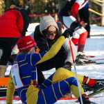Photo by Joey Klecka/Peninsula Clarion Homer freshman Jacob Davis slips while attempting to change his skis at Friday's Kenai Peninsula Borough ski championships, held at the Tsalteshi Trails in Soldotna.
