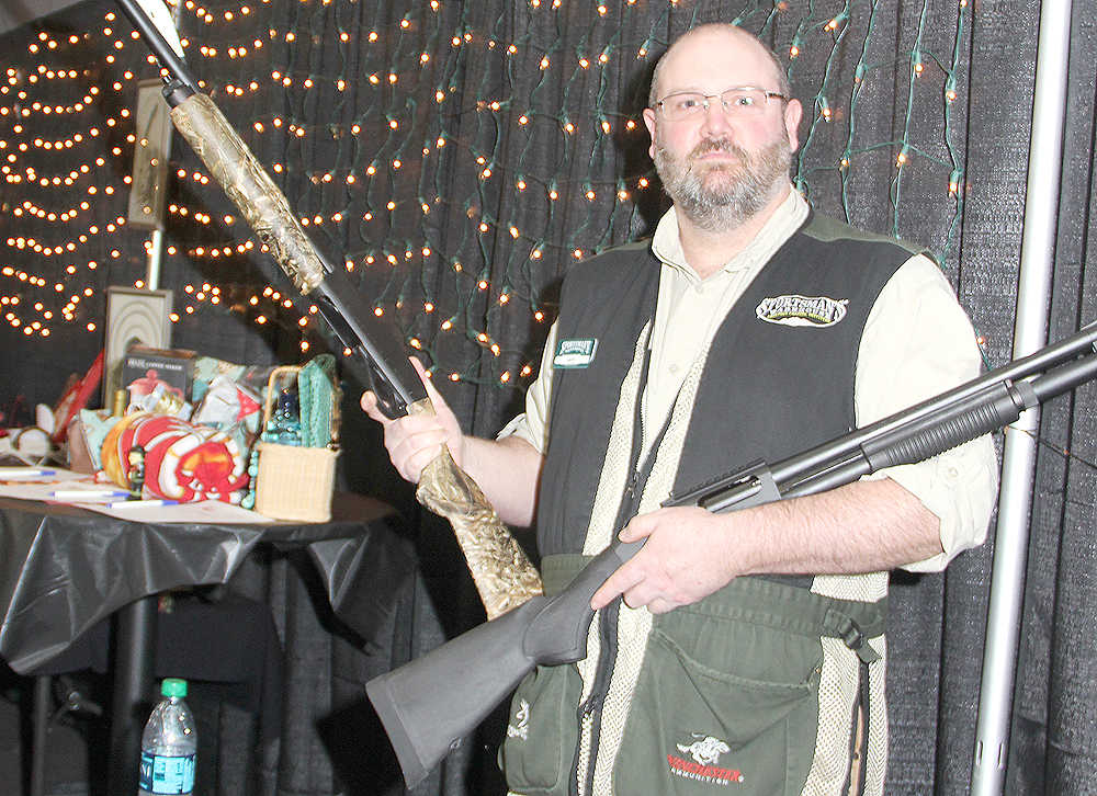 Sportsmen's Warehouse hosts wall of guns at Oiler Gusher