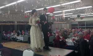 Vintage wedding fashions are modeled during the Kenai Senior Center's Valentine's Day dinner Friday. (Photo by Ian Foley/Peninsula Clarion)