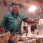 Ben Boettger/Peninsula Clarion Al Janonis with three birch bowls he carved on an electric lathe at a Kenai Peninsula Woodturner's meeting at the "3 Guys, No Wood" workshop on Saturday, Feb. 14.