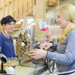 Photo by Kelly Sullivan/ Peninsula Clarion Elizabeth Ward, who owns 'Bead It' with her husband Jimmy Ward, chats with Amiel Severson Monday, Feb. 16, 2015, in Soldotna Alaska. Severson said she comes consistently but refers to herself as an "irregular" customer.