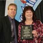 Submitted photo Alaska USA Mortgage Company Assistant Vice President Rhonda Johnson, right, receives the Excellence in Profession award from Soldotna Chamber of Commerce board president Ryan Kapp.