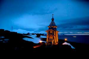 In this Feb. 1, 2015 photo, Holy Trinity church stands illuminated at Russia's Bellinghausen station on King George Island in Antarctica. Holy Trinity is the world's southernmost Eastern Orthodox Church. (AP Photo/Natacha Pisarenko)