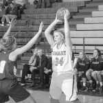 Photo provided by George Fox University Julie Litchfield throws up a shot from beyond the arc.