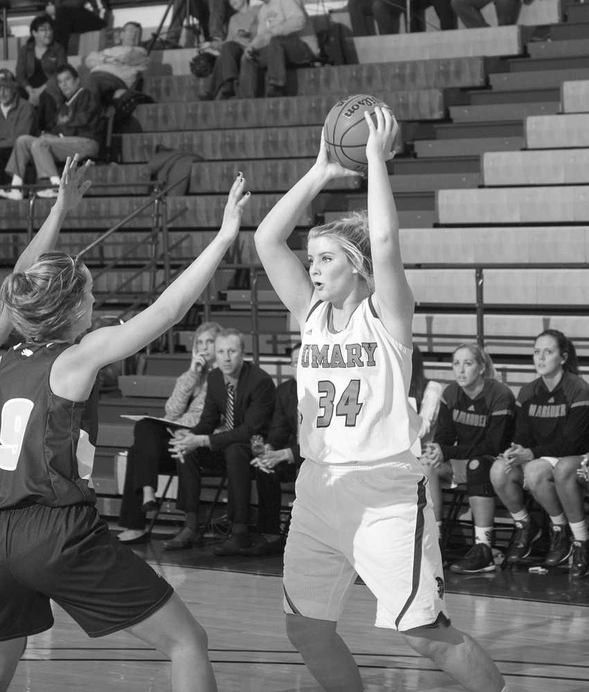 Photo provided by George Fox University Julie Litchfield throws up a shot from beyond the arc.