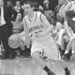 Julie Litchfield throws up a shot from beyond the arc for George Fox University.
