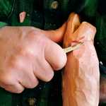 Dennis Bertram, 62, starts to carve a fish decoy in his workshop Tuesday, Feb. 24, 2015, in Belgrade, Minn. "One thing nice about carving, you don't have to go to the blueprints and see if you've got it right or not," Bertram told the St. Cloud Times. (AP Photo/St. Cloud Times, Jason Wachter) NO SALES
