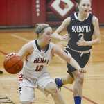 Photo by Rashah McChesney/Peninsula Clarion  Kenai's Allie Ostrander takes off after Soldotna's Lindsey Wong during their game for the Northern Lights Basketball Tournament on Thursday March 5, 2015 in Kenai, Alaska.