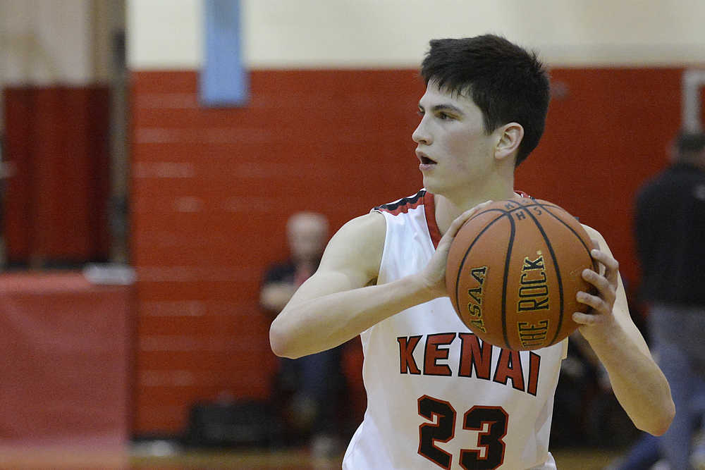 Photo by Rashah McChesney/Peninsula Clarion Kenai's  Allie Ostrander takes a pass from Alli Steinbeck during their game against Soldotna for the 2015 Northern Lights Basketball tournament on Kenai, Alaska.