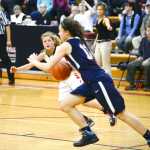 Photo by Rashah McChesney/Peninsula Clarion  Kenai's Marshall Vest looks for an opening to pass during their game against Soldotna at the Northern Lights Basketball Tournament on Thursday March 5, 2015 in Kenai, Alaska.