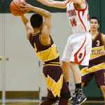 Photo by Rashah McChesney/Peninsula Clarion  Seldovia's Calem Collier jumps to block a pass during their game against Kotlik for the 2015 March Madness Small School Tournament in Anchorage, Alaska.