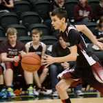 Photo by Rashah McChesney/Peninsula Clarion  Nikolaevsk's Nikit Fefelov runs the ball down the court during a game against Elim for the 2015 March Madness small schools basketball tournament on March 17, 2015 in Anchorage, Alaska.