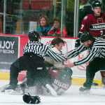 Photo by Rashah McChesney/Peninsula Clarion Referees break up a fight during the Kenai River Brown Bears' game against the Fairbanks Ice Dogs on Friday March 20, 2015 in Soldotna, Alaska.