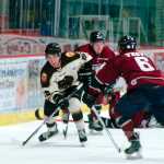 Photo by Rashah McChesney/Peninsula Clarion Kenai River Brown Bears' Joey Sardina looks down the ice for an opening during their game against the Fairbanks Ice Dogs on Friday March 20, 2015 in Soldotna, Alaska.