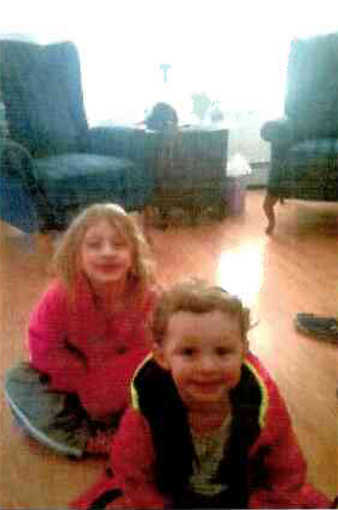 (AP Photo/Peninsula Clarion, Rashah McChesney) An investigator marks a stump within a parameter set up on Sunday March 22, 2015 between Borgen Avenue and Alpine Drive where Kenai Police have what they believe to be the remains of a family who have been missing from their Kenai, Alaska home for more than 10 months. The remains were found fewer than 2 miles from the family's home.