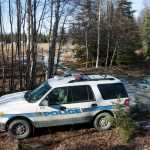 Photo by Rashah McChesney/Peninsula Clarion Investigators set up a temporary facility between Alpine Drive and Borgen Avenue on Sunday March 22, 2015 after finding the remains of what Kenai Police believe to be a family that has been missing for nearly 10 months from their Kenai, Alaska home. While most of the land in the immediate area is state or federally owned, the place where police and the Federal Bureau of Investigation investigators is focusing their efforts, is a privately owned parcel which belongs to a woman from Sterling, Alaska.