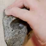 Photo by Rashah McChesney/Peninsula Clarion Callen Ireland, 11, grips a rock at Redoubt Rock Climbing in Nic and Natalie Larson's home on Wednesday April 1, 2015 in Soldotna, Alaska. The Larsons offer climbing lessons and open gym periods in their Soldotna home.