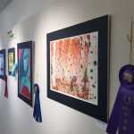 By Ian Foley/Peninsula Clarion Paintings, including the "Best of Show" winner by artist Christopher Hogness, are displayed at the Kenai Arts Guild on Thursday, April 2 in Kenai.