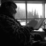 Photo by Rashah McChesney/Peninsula Clarion  Larry Hull reads an autobiography on Sammy Davis Junior on Wednesday April 8, 2015 at the Kenai Community Library in Kenai, Alaska.
